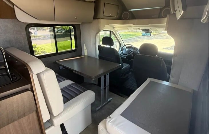 front seats spin 360 degrees allowing for 6 people to sit at table at once