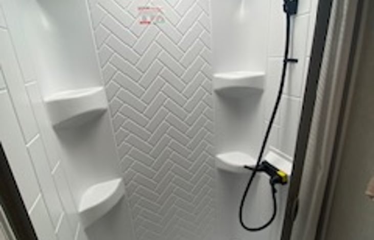 Standing shower with removable shower head
