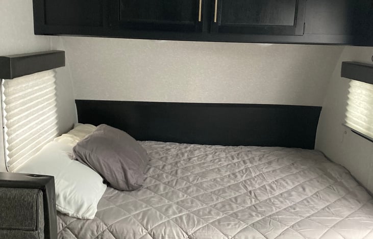 Jake offers a full size queen mattress with convenient overhead and under bed storage.