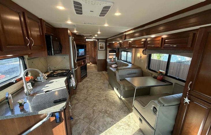 "Relax and unwind in your rolling lounge. Plush sofa dining for four and steaming on every screen- comfort meets adventure."