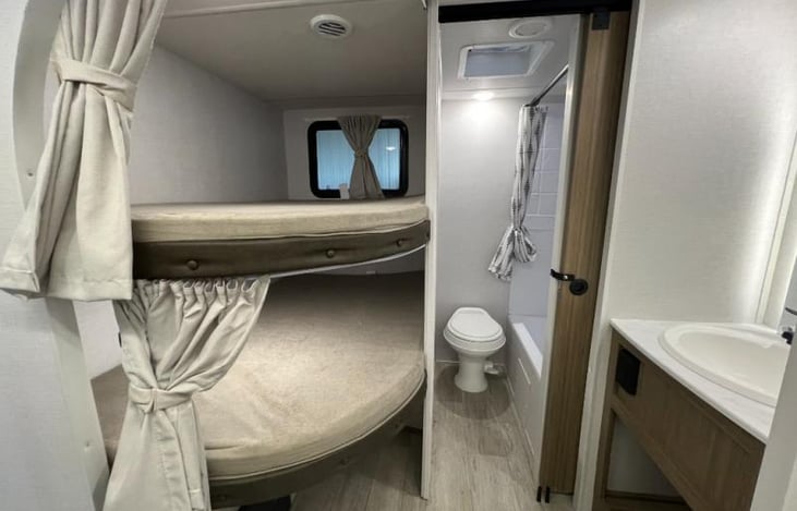 Double bunks with USB ports, individual lights and curtains.