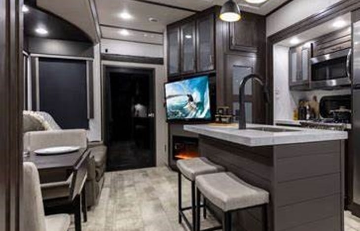 Lots of room enjoying the fireplace for heat or light