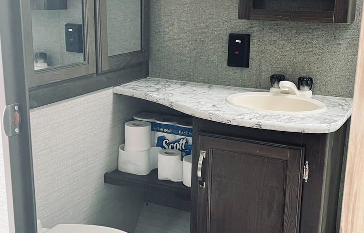 Toilet, sink, and tons of storage.