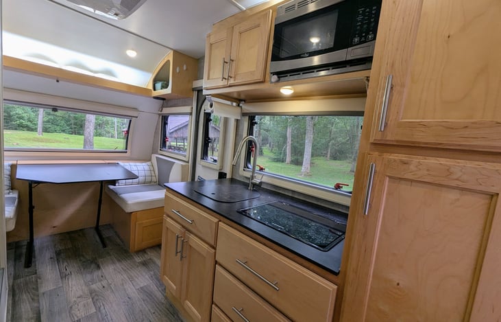 Solid cabinetry and pop-out windows throughout make this interior classy, bright and accommodating. Ample storage and everything you will need to enjoy your experience.