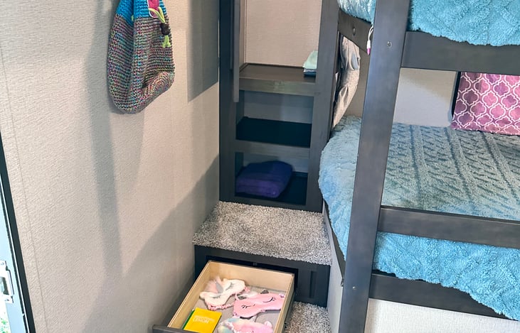 Some unicorn sleep masks for the kids just for fun. Lots of storage for their things.