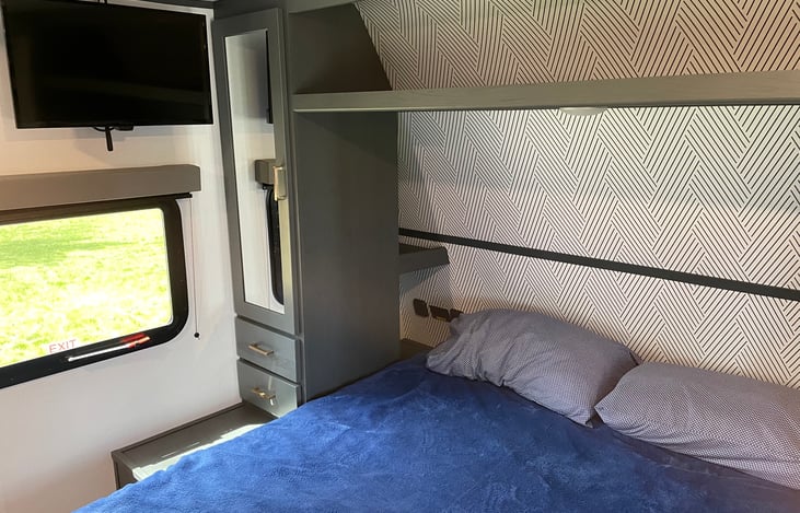 Queen bedroom with doors for privacy.  2nd TV in bedroom.