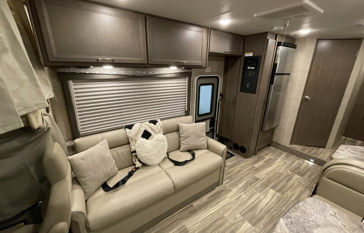 Couch, Entrance, Refrigerator and bathroom door