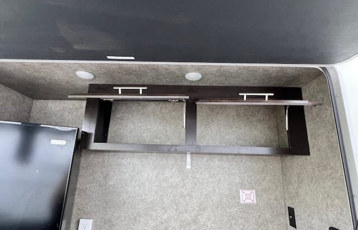 Outdoor kitchen over head storage.