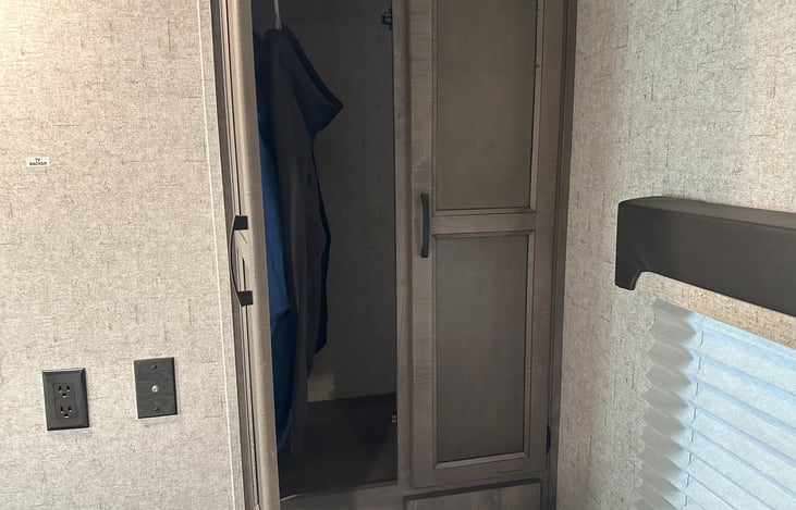 Large storage closet in bedroom.