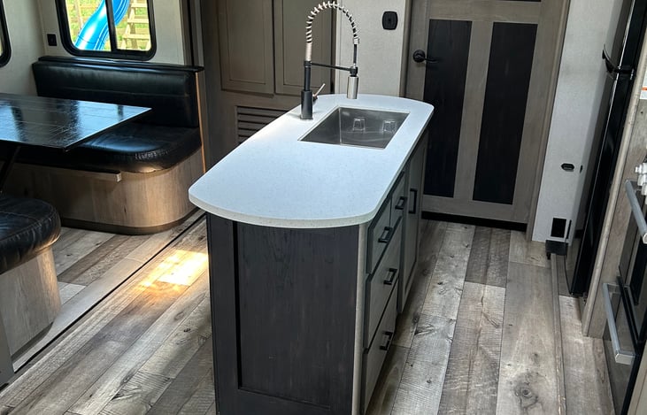 Spacious galley and fully-equipped kitchen. Plenty of room for everyone. Private bunkhouse and private bedroom on opposite ends. Pop-up TV to keep everyone entertained. Ample storage.