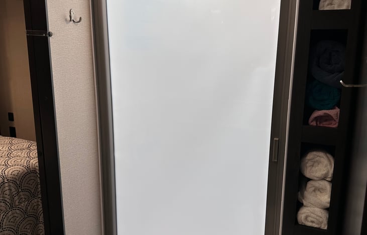 Shower screen closed. Loads of towels for you to use