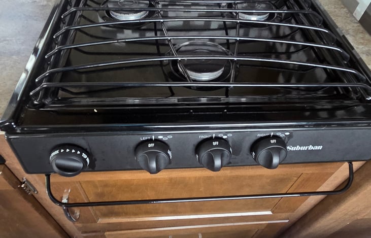 Kitchen: 3-burner range that runs on electric or propane.