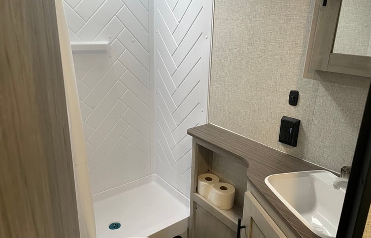 Bathroom with vanity and large shower