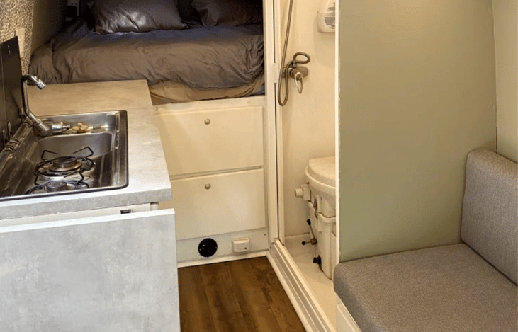 Below the drawers you'll notice the outlet for the 5KW diesel heater. This thing is insanely powerful, and has kept me toasty even in the middle of a snow storm in Vermont!