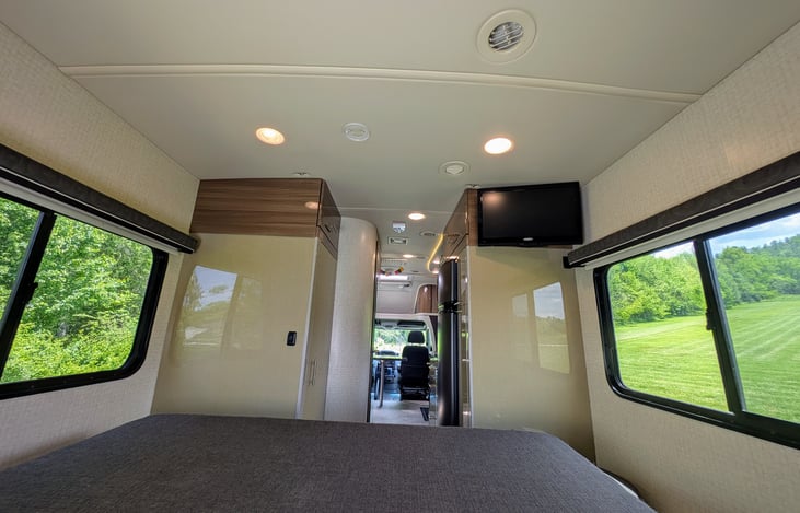 Classy and well-appointed interior with ample storage and premium materials throughout. Many windows and large skylight provide ample natural light throughout.