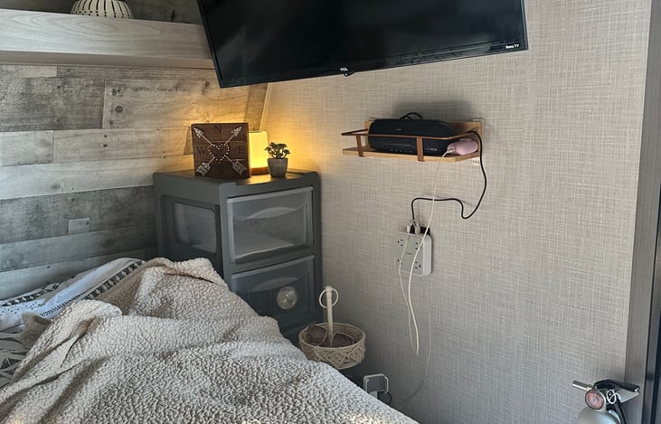 drawers, Bluetooth speaker, Rukku tv, phone charging station.