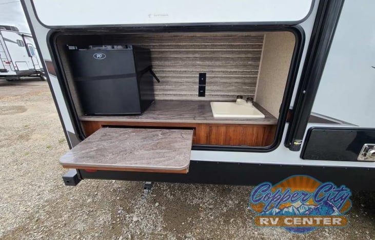 Outside kitchen with mini- frig