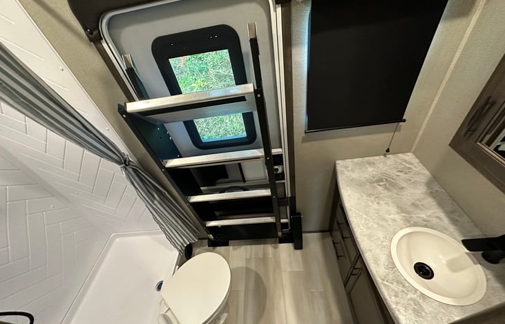 Back Bathroom off the kids room with a back door.