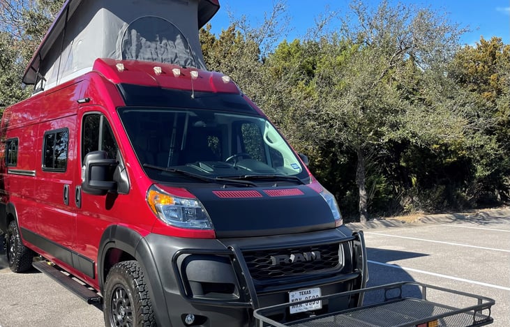 Outfitted with optional, add-on cargo rack mounted to front hitch (can also be mounted to rear hitch).
