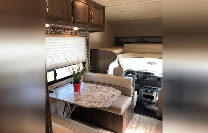 Dinette table & loft bed above the cab.