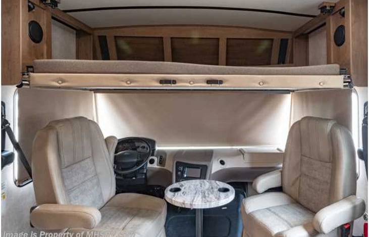 Bunk bed on top of driver seats can fit 2 adults