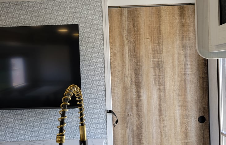 Door off kitchen leading to master bedroom