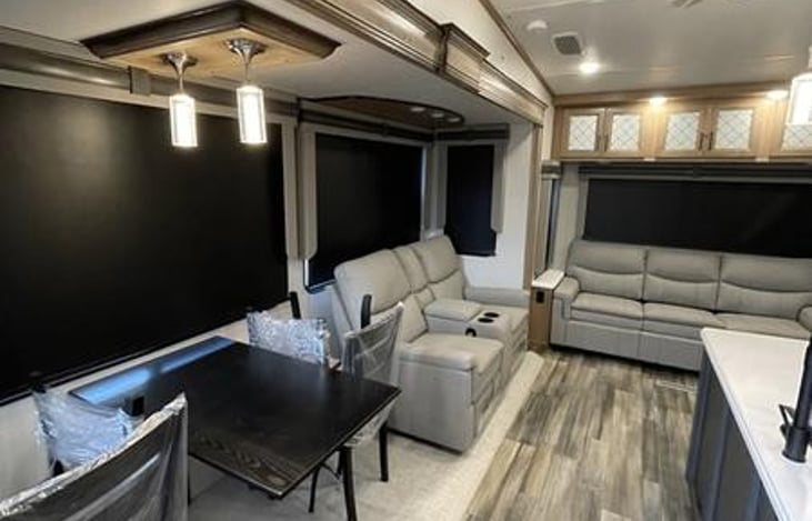 Double reclining sofa, and three seater queen sofabed, with dinner table for 4.