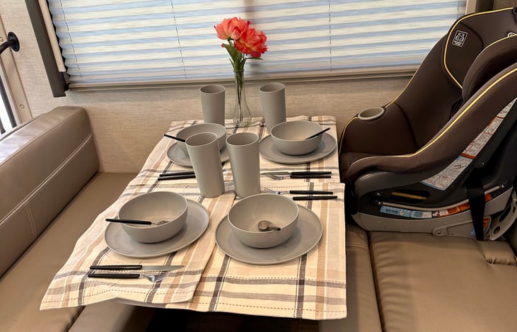 Kitchen dinette for 4. We currently have our car seat there for a trip. This unit has a built-in child seat lock that is locked to the frame.