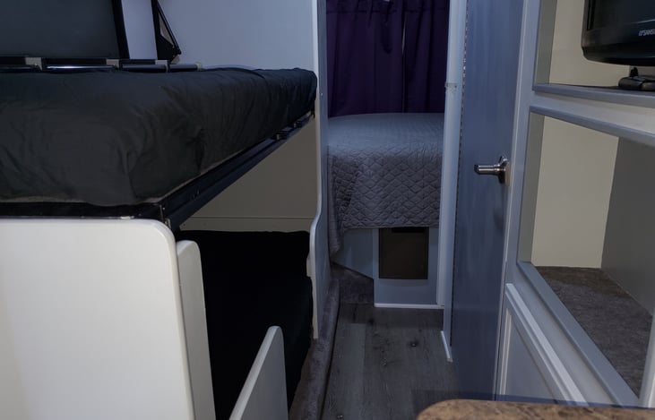 Space with slides in while RV is in motion. Access to bathroom.