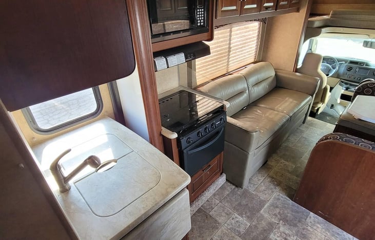 kitchen and stove view with slide in