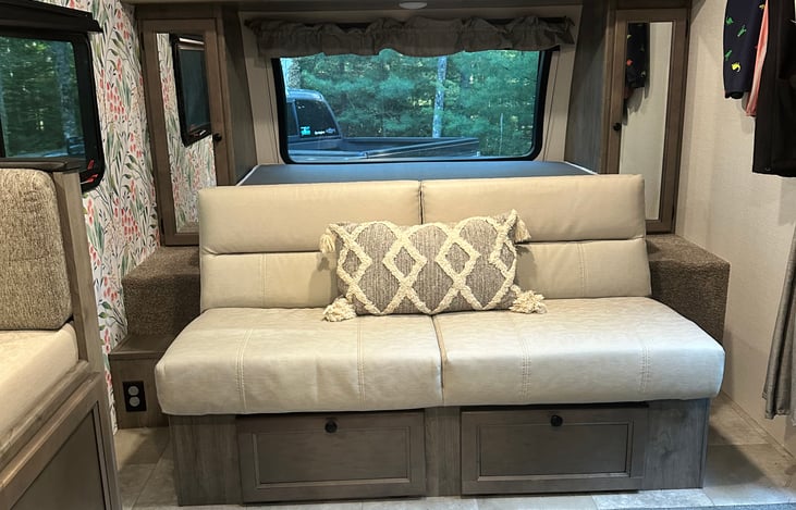 queen bed can be left down or folded up to allow a sitting designated sitting area during the day

storage underneath for boots and shoes