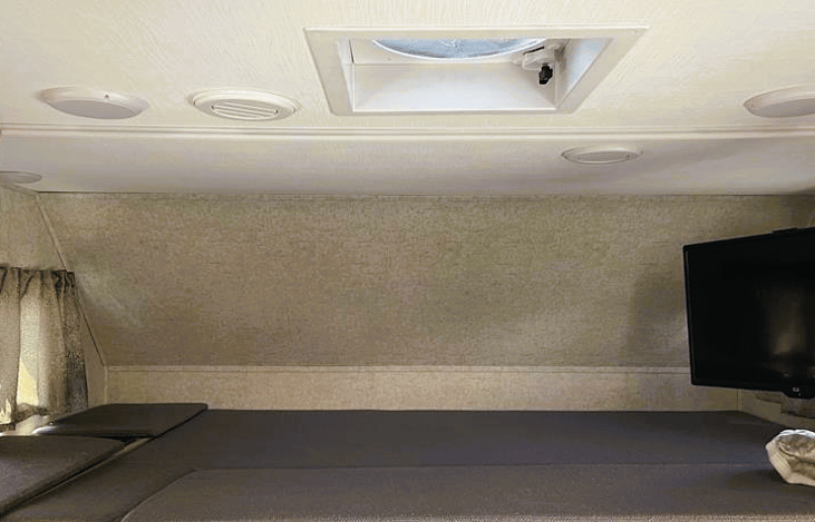 Queen size over head bunk. Swivel TV.