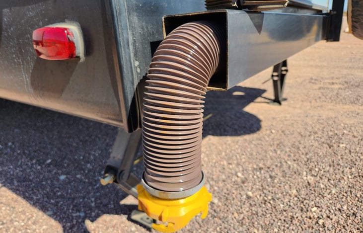 Sewer hose stored in the bumper