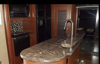 Luxurious Toy-hauler with 3 slides and 14' garage.