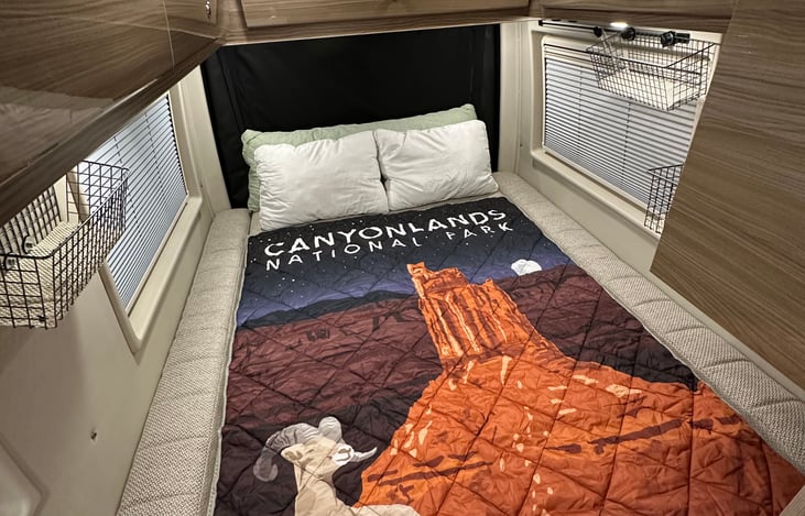 Bed made down. Queen size.