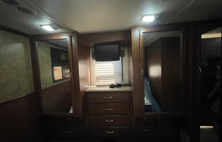 The bedroom TV is equipped with Apple TV and a free guest account for Amazon Prime, Apple TV, and Paramount. His and her closets.