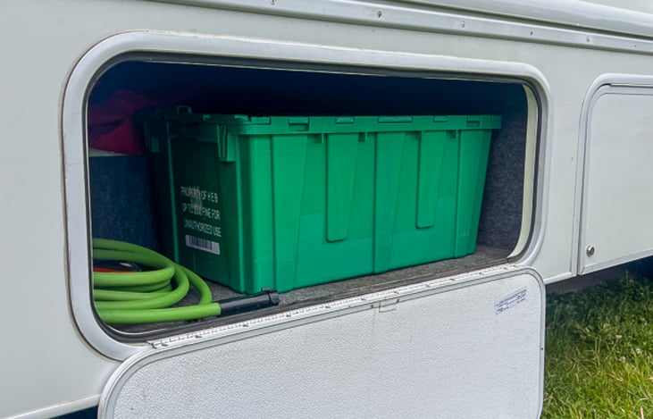 Ample lower storage bays for equipment and gear.  Lockable all the way around.  This bay pictures the fresh water and dump station equipment.