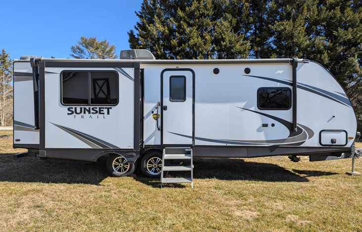 Luxury 30' triple-slide trailer with a gourmet rear kitchen & private master suite. Massive open-concept living and theater seating—the ultimate upscale home on wheels for your next getaway!