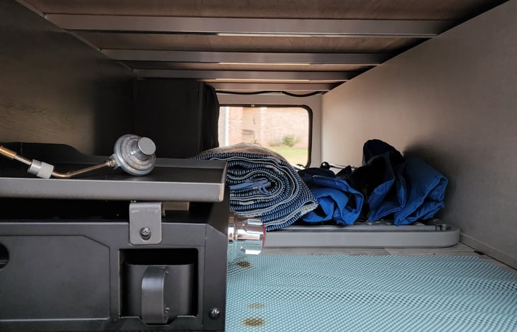 Excellent storage with outdoor grill, 2 rugs, 6 chairs, and folding table.