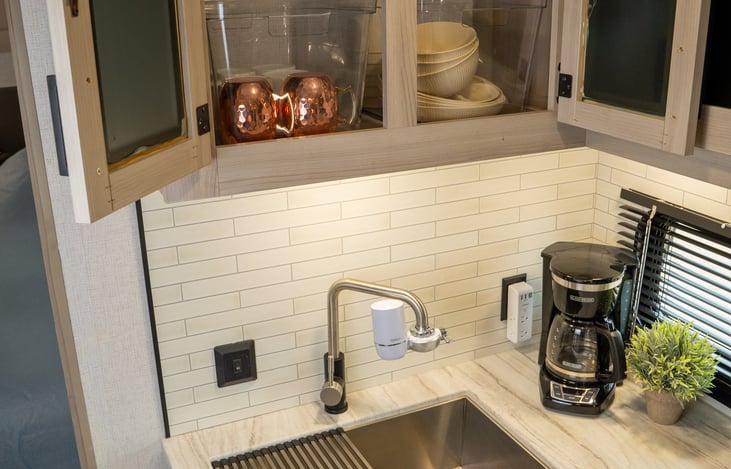 kitchen comes fully stocked with Pur faucet filter, coffee maker, coffee mugs, plates, bowls, pots and pans, fresh sponge, dish soap, hand soap, paper towels, silverware, food storage bags, foil, etc.