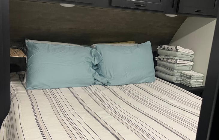 Queen size bed in master bed with storage.