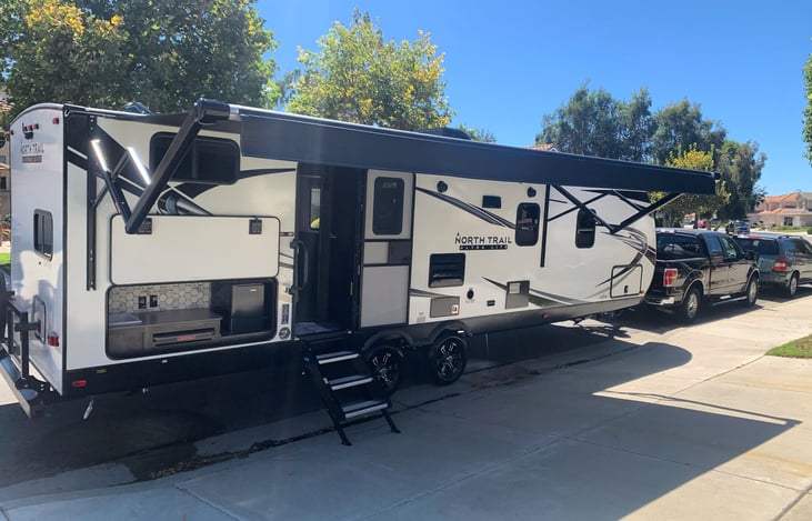 Opened up front.  Coverages from the sun and a party center for cold drinks, washing hands, and prepping food