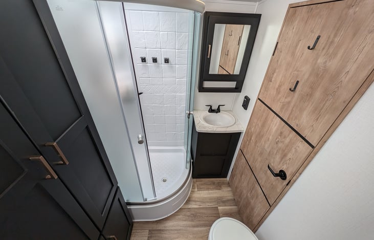 Spacious bathroom, large shower and extra storage