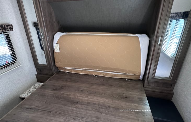 Unlatch the bed (Step 2) and unroll the mattress