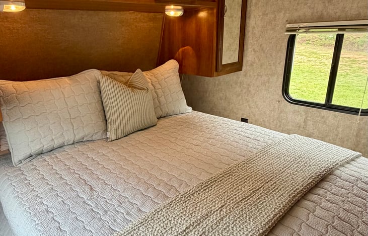 Private queen bed in the primary bedroom