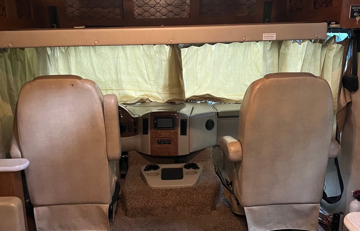 Captain’s chairs with the bunk down.