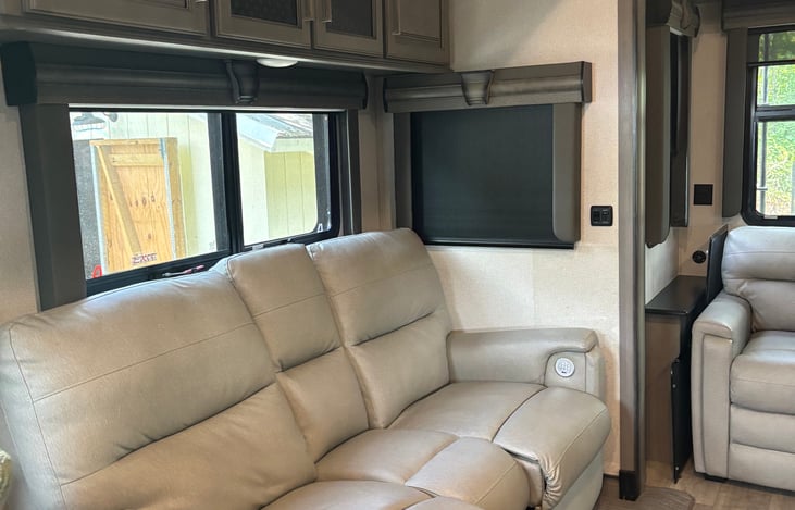 Main living room area with recliners and sleeper sofa