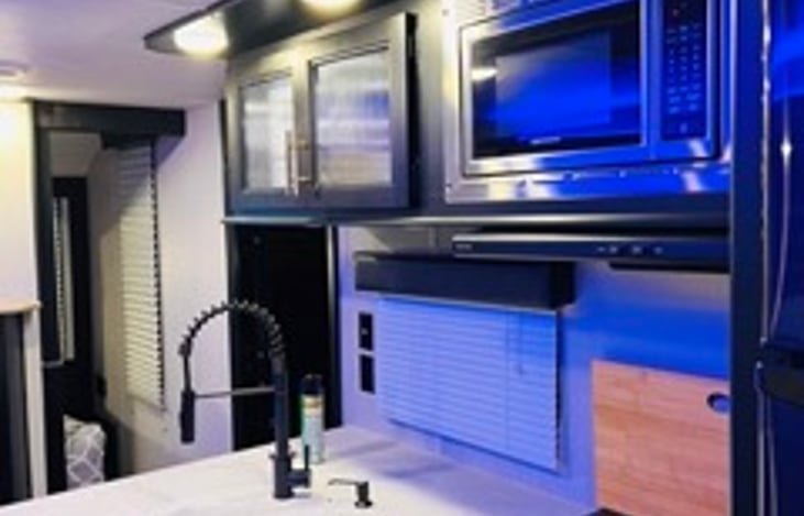 Kitchen has ample storage space and plenty of room for food prep.