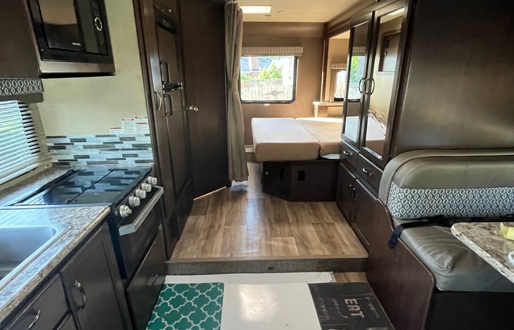 View from front of camper back toward bathroom and bed (fully extended).