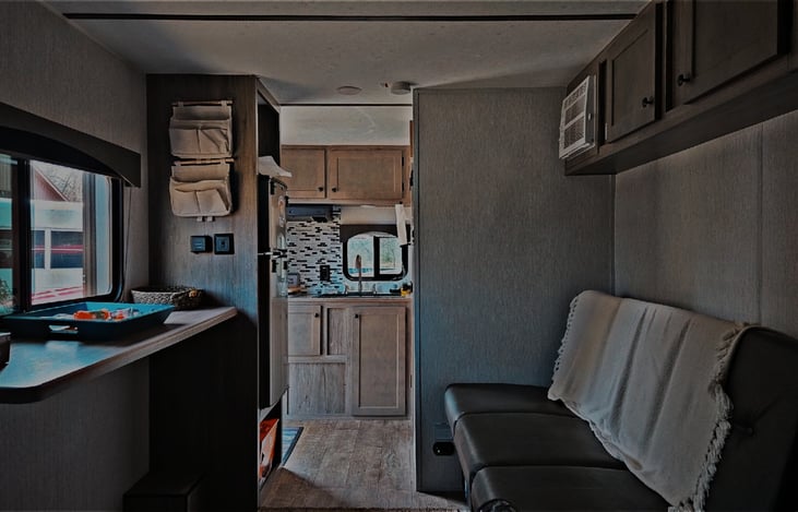 fold out couch, bar and kitchen.